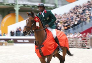 Abdelkebir Ouaddar of Morocco riding Quickly de Kreisker celebrates winning the Grand Prix Hermes CSI5 show jumping event on day three of the Saut Hermes at the Grand Palais venue on March 20, 2016 in Paris, France.